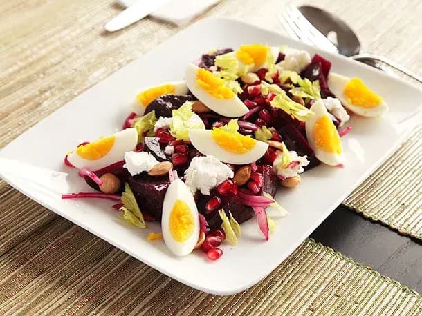 Image of Roasted-Beet Salad With Goat Cheese, Eggs, Pomegranate, and Marcona Almond Vinaigrette recipe