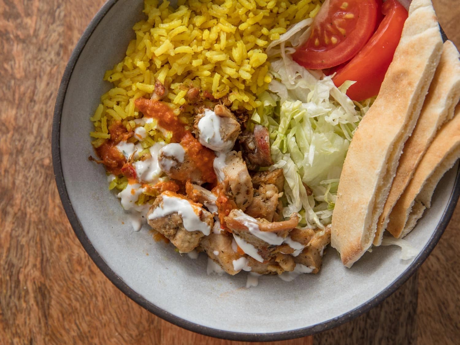 Image of Serious Eats' Halal Cart-Style Chicken and Rice With White Sauce recipe
